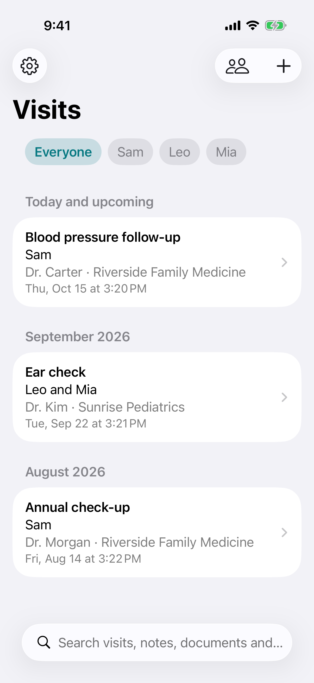 The WellHeard home screen on iPhone: everyone's doctor visits grouped by month, with buttons to show one family member's visits.